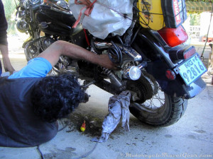 The boss fixing the chain guard.